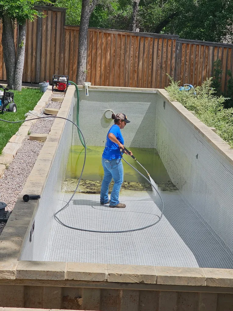 Gold Star technician resurfacing a backyard pool